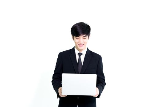 Asian business handsome man has holding laptop for woking with happy and relaxing isolated on white background.