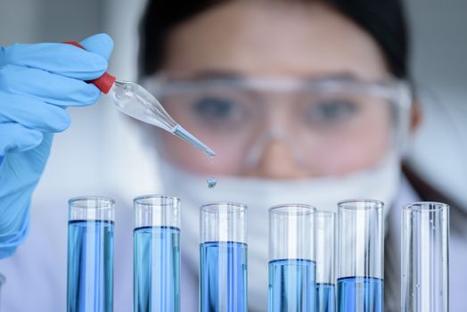 Asian young girl student scientist researching  and learning in a laboratory.