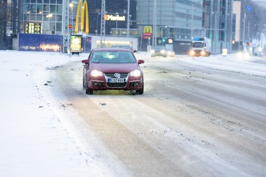 Editorial: Helsinki City, Finland, 21th December 2018. Car on the road with snow in winter season at Helsinki, Finland.