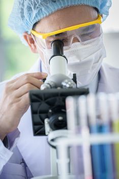 Asian young man student scientist researching  and learning in a laboratory.