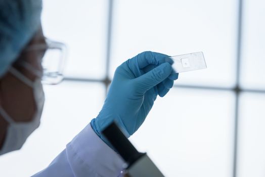 Asian man scientist researching  and learning in a laboratory.