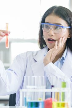 Asian young girl student scientist researching  and learning in a laboratory.