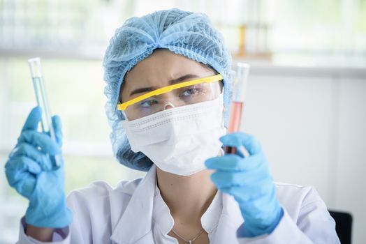 Asian young girl student scientist researching  and learning in a laboratory.