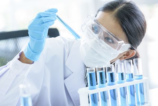 Asian young girl student scientist researching  and learning in a laboratory.