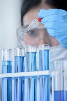 Asian young girl student scientist researching  and learning in a laboratory.