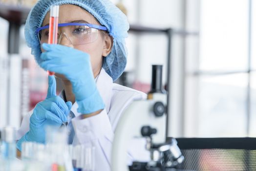 Asian young girl student scientist researching  and learning in a laboratory.