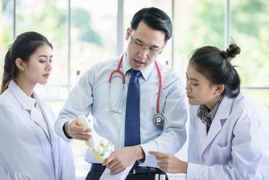 Asian teacher has teaching to student about science and anatomical in laboratory