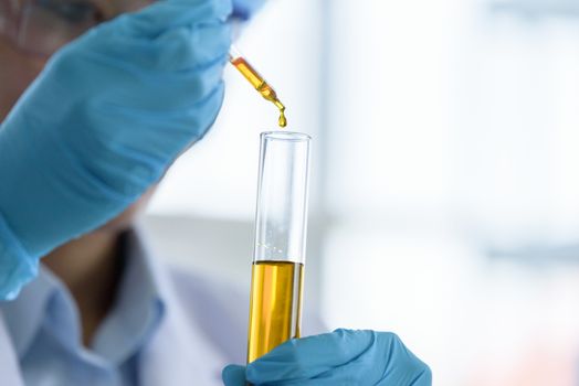 Asian young girl student scientist researching  and learning in a laboratory.