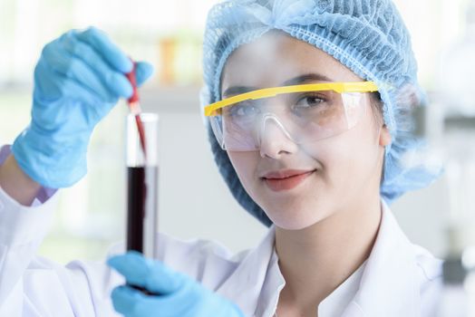 Asian young girl student scientist researching  and learning in a laboratory.