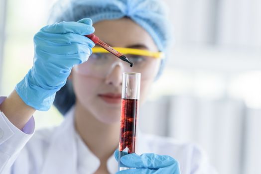 Asian young girl student scientist researching  and learning in a laboratory.