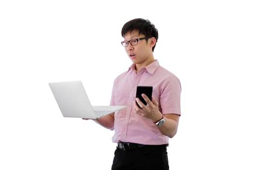 Asian young businessman has standing and  holding phone and laptop for working with busy on isolated on wihte background.