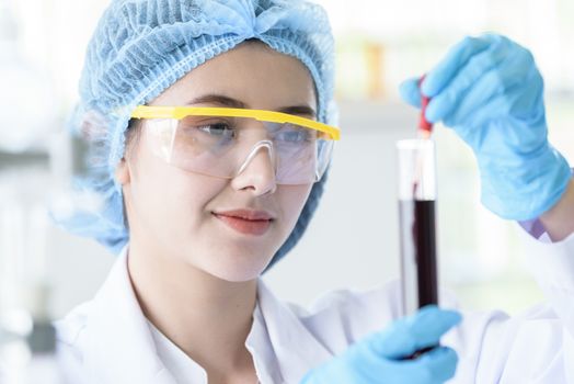 Asian young girl student scientist researching  and learning in a laboratory.