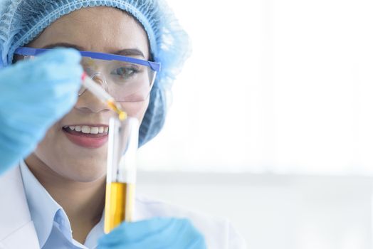 Asian young girl student scientist researching  and learning in a laboratory.