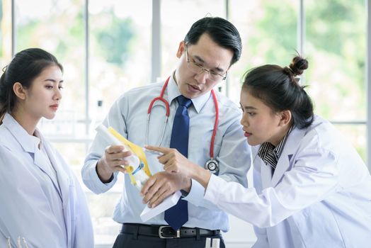 Asian teacher has teaching to student about science and anatomical in laboratory