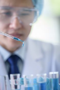 Asian senior scientist male researching and learning in a laboratory.