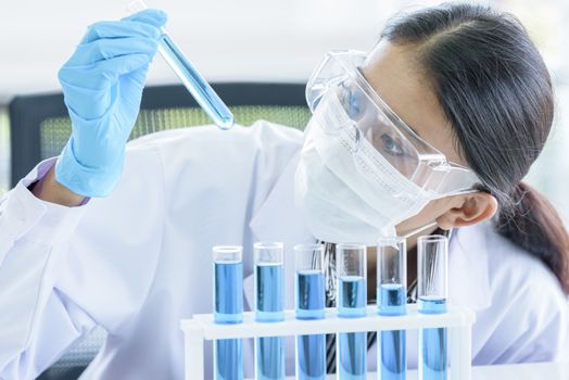 Asian young girl student scientist researching  and learning in a laboratory.