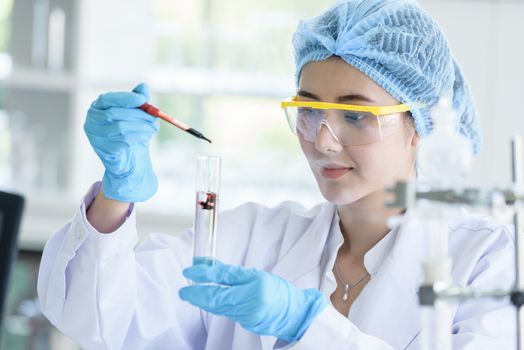 Asian young girl student scientist researching  and learning in a laboratory.