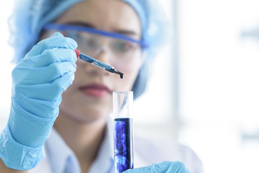 Asian young girl student scientist researching  and learning in a laboratory.