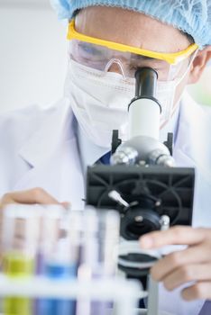 Asian young man student scientist researching  and learning in a laboratory.