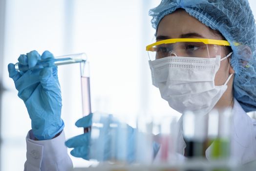 Asian young girl student scientist researching  and learning in a laboratory.