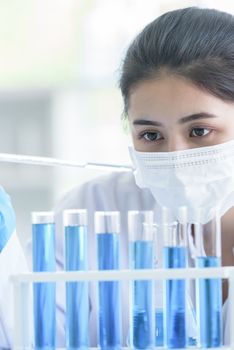 Asian young girl student scientist researching  and learning in a laboratory.