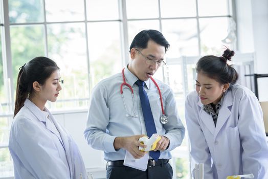 Asian teacher has teaching to student about science and anatomical in laboratory