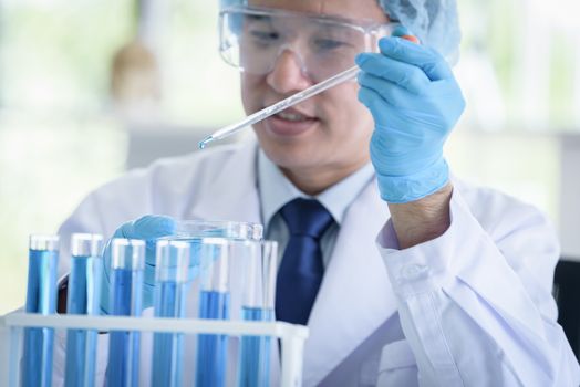 Asian senior scientist male researching and learning in a laboratory.