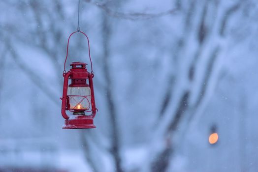 The red lamp in the forest with heavy snow in the winter season at Tuupovaara, Finland.