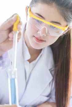 Asian yound student scientist researching  and learning with senior scientist have teaching background in a laboratory.