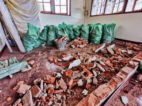 Room and interior and red brick destroyed in the room.