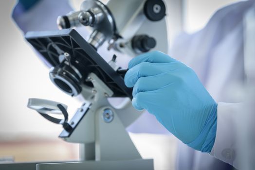 Asian man scientist researching  and learning in a laboratory.