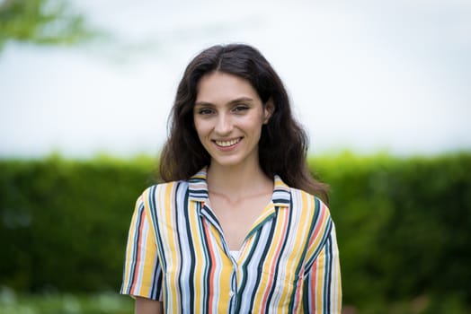 Portrait of a beautiful woman smiling in the garden.