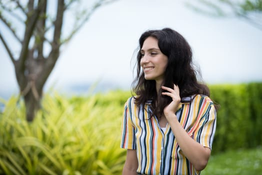 Portrait of a beautiful woman smiling in the garden.