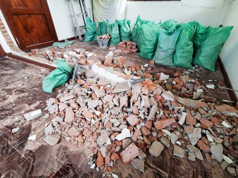 Room and interior and red brick destroyed in the room.