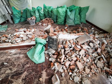 Room and interior and red brick destroyed in the room.