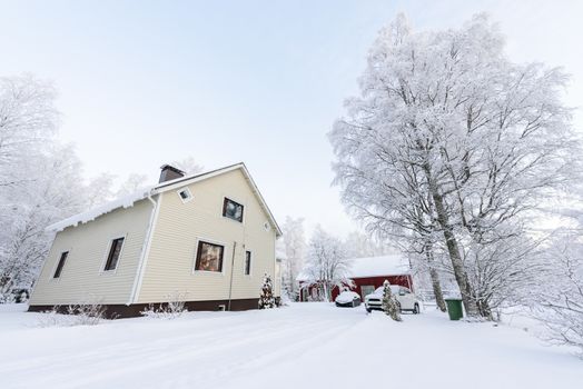 The house in the forest has covered with heavy snow in winter season at Lapland, Finland.