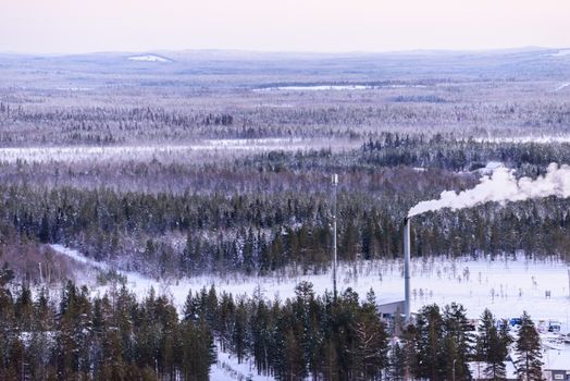 The landscape forest has covered with heavy snow and sunset sky from top view landscape in winter season at Lapland, Finland.