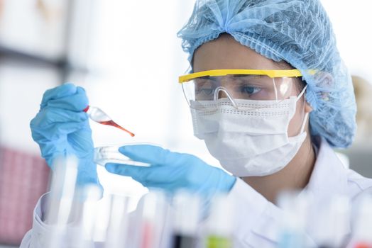 Asian young girl student scientist researching  and learning in a laboratory.