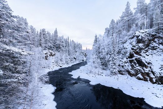 The river in winter season at Oulanka National Park, Finland.