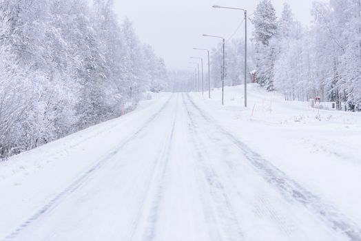 The road number 496  has covered with heavy snow in winter season at Lapland, Finland.