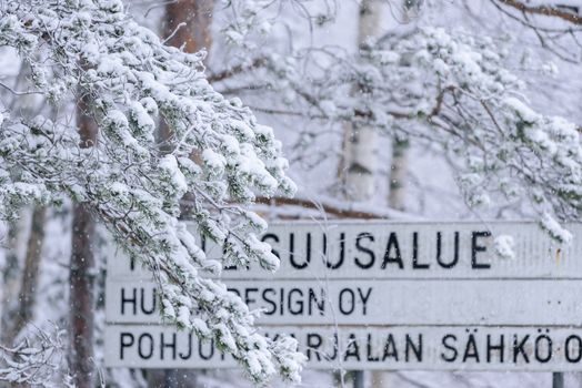 The forest has covered with heavy snow and bad weather sky in winter season at Lapland, Finland.