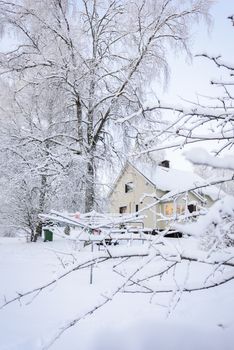 The house in the forest has covered with heavy snow in winter season at Lapland, Finland.