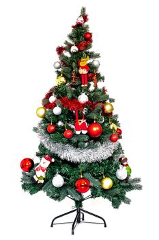 The Christmas tree with ornaments and presents isolated on white background.