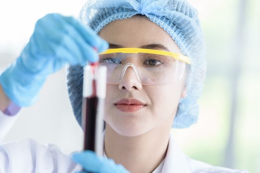 Asian young girl student scientist researching  and learning in a laboratory.