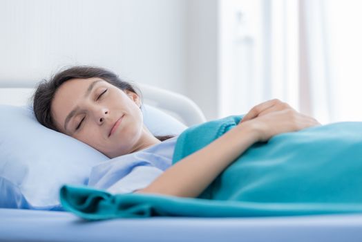 The patient woman has sleeping at the hospital.