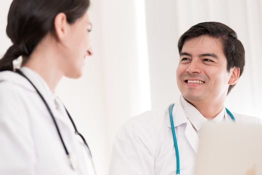 Two doctors have working together with happiness in the hospital.