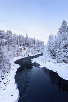 The river in winter season at Oulanka National Park, Finland.