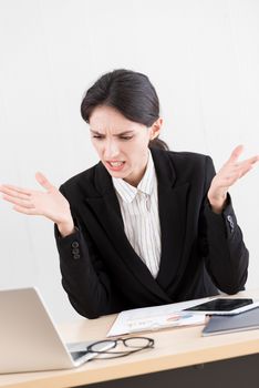 A businesswoman has concentrate working with and upset and unhappy.