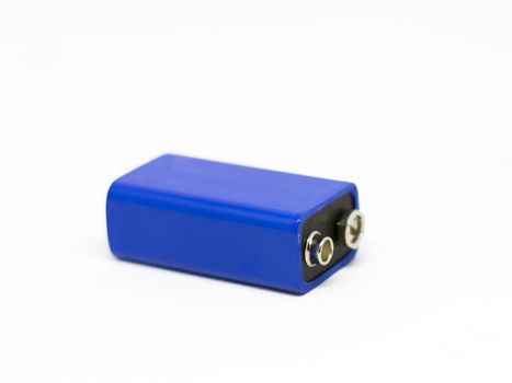 a blue 9 volt battery isolated on a white background. Power supply. Copy space. Environmental pollution