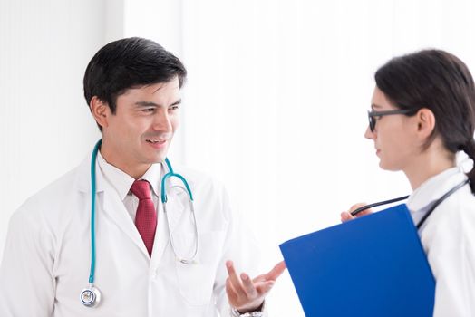 Two doctors have working together with happiness in the hospital.